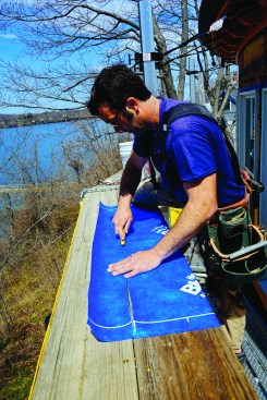 Blueskin VP 100 is easy to handle and apply. Pollard cut the material to size by slitting it with a utility knife.