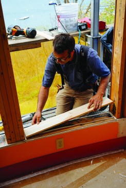 Then a piece of clapboard to slope the sill