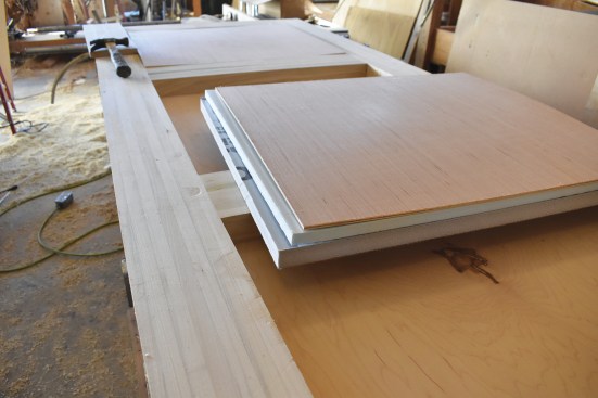 The voids of the door are filled with two layers of ridged foam and plywood.