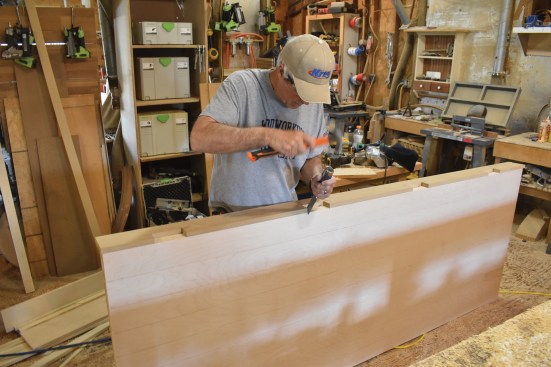 Using the new jig, the author marks out hinge placement.