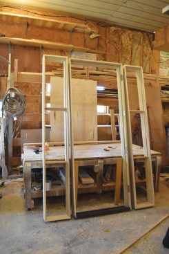 The author gives the assembled frames a final check before installing them.