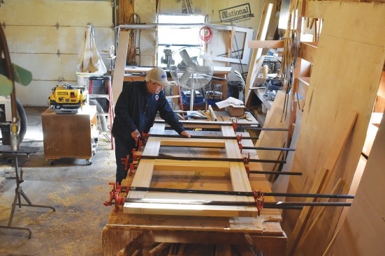 With the dominos placed, the door is glued up and clamped.