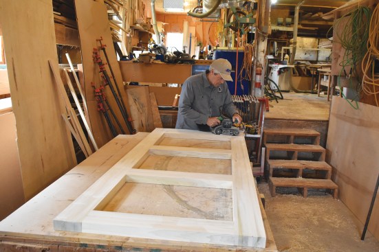 The joints are sanded flat to remove any high spots.